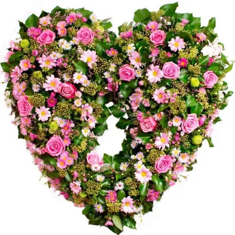 Corona de flores para funeral en forma de corazón.