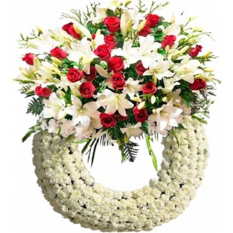 Corona funeraria blanca y roja en Madrid
