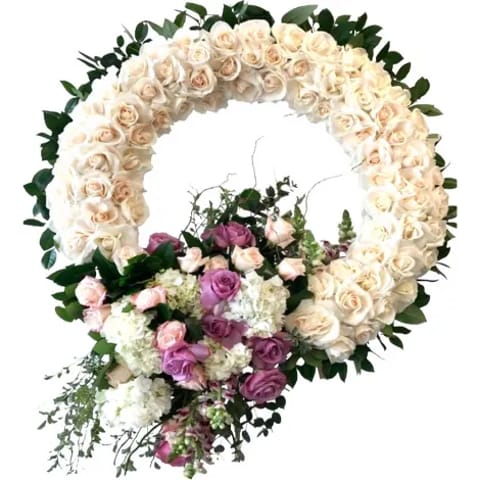 Venta de corona de rosas blancas para condolencias en Madrid.